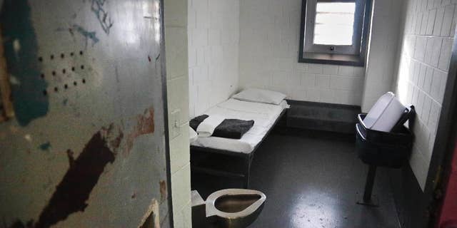 FILE - This Jan. 28, 2016 file photo shows a solitary confinement cell at New York City's Rikers Island jail. An internal report finds New York City's Rikers Island jail has entrenched problems responding to sexual abuse complaints. The troubles cited include emergency hotlines that don't work, confidential complaints read by fellow inmates and investigations that don't interview alleged attackers. (AP Photo/Bebeto Matthews, File)