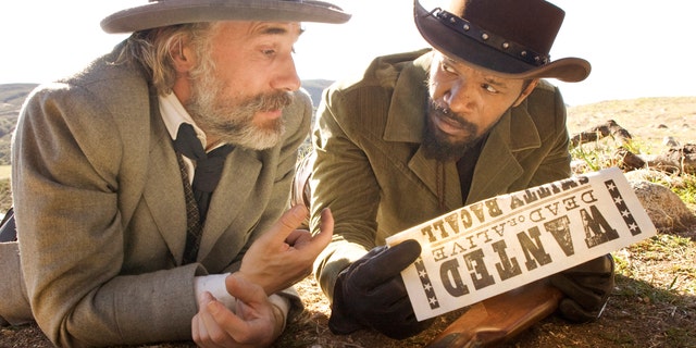 This undated publicity image released by The Weinstein Company shows, Christoph Waltz as Schultz, left, and Jamie Foxx as Django in the film, "Django Unchained," directed by Quentin Tarantino. Foxx says Hollywood should take some responsibility for tragedies such as the deadly school shooting in Connecticut on Friday, Dec. 14, 2012. In an interview Saturday, Dec. 15, 2012, Foxx said actors cannot "turn their back" on that fact that movie violence can "influence" people. (AP Photo/The Weinstein Company, Andrew Cooper, SMPSP)