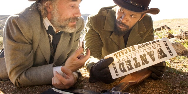 This undated publicity image released by The Weinstein Company shows, Christoph Waltz as Schultz, left, and Jamie Foxx as Django in the film, "Django Unchained," directed by Quentin Tarantino. Foxx says Hollywood should take some responsibility for tragedies such as the deadly school shooting in Connecticut on Friday, Dec. 14, 2012. In an interview Saturday, Dec. 15, 2012, Foxx said actors cannot "turn their back" on that fact that movie violence can "influence" people. (AP Photo/The Weinstein Company, Andrew Cooper, SMPSP)
