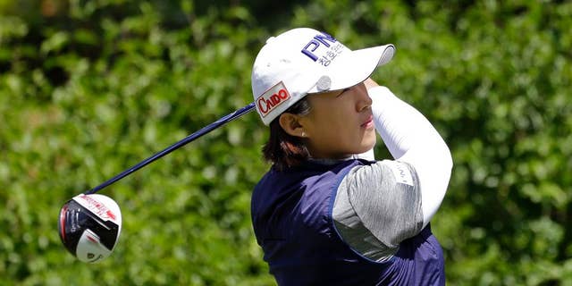 Amy Yang, of South Korea, tees off on the first hole in the final round at the Women's PGA Championship golf tournament at Sahalee Country Club Sunday, June 12, 2016, in Sammamish, Wash. (AP Photo/Elaine Thompson)