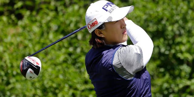 Amy Yang, of South Korea, tees off on the first hole in the final round at the Women's PGA Championship golf tournament at Sahalee Country Club Sunday, June 12, 2016, in Sammamish, Wash. (AP Photo/Elaine Thompson)