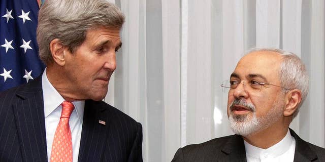 Secretary of State John Kerry, left, listens to Iran's Foreign Minister Mohammad Javad Zarif.