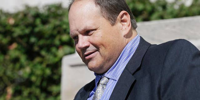 FILE - In this Sept. 9, 2015, file photo, former Multi-State Lottery Association security director Eddie Tipton leaves the Polk County Courthouse in Des Moines, Iowa, after his sentencing in a jackpot-fixing scandal. Tipton's attorney is arguing to the Iowa Court of Appeals that his client's conviction last year on fraud charges should be thrown out. Tipton, is appealing his July 2015 convictions related to fixing an Iowa Hot Lotto game in 2010, which resulted in a 10-year prison sentence. (AP Photo/Charlie Neibergall, File)