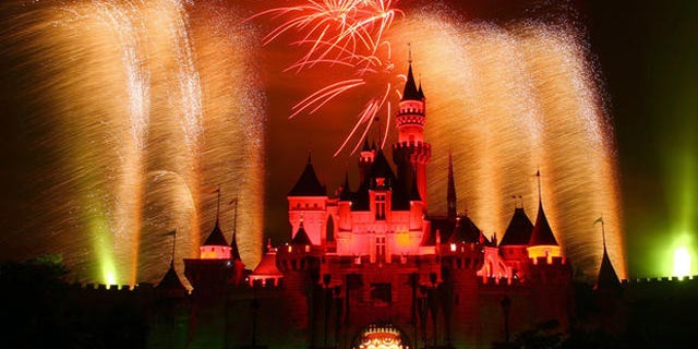 In this photo provided by Disney, fireworks light up the sky above Sleeping Beauty Castle at Hong Kong Disneyland Sept. 12, 2006 on the vacation resort's first birthday.  Hong Kong Disneyland opened Sept. 12, 2005.  (AP Photo/Disney, Gary Kwok) **NO SALES**