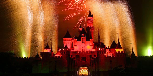 In this photo provided by Disney, fireworks light up the sky above Sleeping Beauty Castle at Hong Kong Disneyland Sept. 12, 2006 on the vacation resort's first birthday. Hong Kong Disneyland opened Sept. 12, 2005. (AP Photo/Disney, Gary Kwok) **NO SALES**