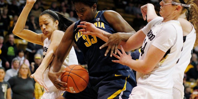 California center Talia Caldwell, center, pulls down a rebound as Colorado forwards Arielle Roberson, left, and Jen Reese cover in the second half of California's 53-49 victory in an NCAA college basketball game in Boulder, Colo., Sunday, Jan. 6, 2013. (AP Photo/David Zalubowski)