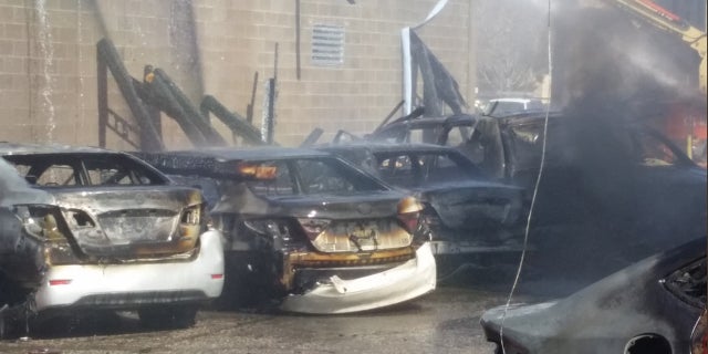 About 30 vehicles were damaged or destroyed in Wednesday's fire, officials said.