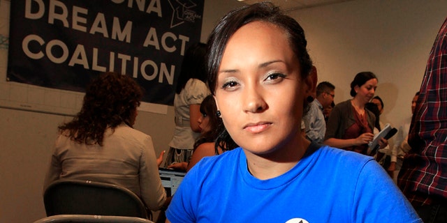 Erika Andiola poses for a portrait at a site where people line up to get guidance on Deferred Action.