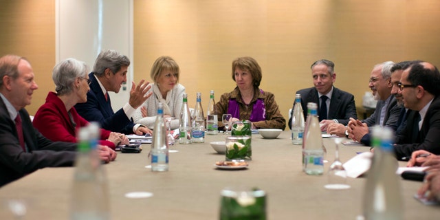 In this Nov. 9, 2013, photo, U.S. Secretary of State John Kerry, third left, meets with EU High Representative for Foreign Affairs, Catherine Ashton, center, and Iranian Foreign Minister Mohammad Javad Zarif, third right, at the Iran Nuclear talks in Geneva, Switzerland. The deadlocked international effort to sign a nuclear deal with Iran has spurred a global blame game over who walked away from the negotiating table and why. It's a war of words playing out in public statements from top officials and across social media, with a bluntness that stands in stark contrast to the secretive and diplomatic nature of the negotiations themselves. And it raises questions about whether the debate will compound the years of mistrust between Iran and the West when the parties reconvene in Geneva for another round of talks next week. (AP Photo/Jason Reed, Pool)