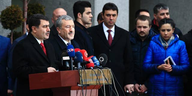 Istanbul Gov. Vasip Sahin, left, accompanied by Police Chief Mustafa Caliskan, second from left, talks to the media during a news conference regarding the arrest of a suspect of New Year's nightclub attack in Istanbul, Tuesday, Jan. 17, 2017. Turkish officials on Tuesday confirmed that the gunman who carried out the deadly New Year's attack on an Istanbul nightclub, which was claimed by the Islamic State group, has been detained. (AP Photo/Lefteris Pitarakis)
