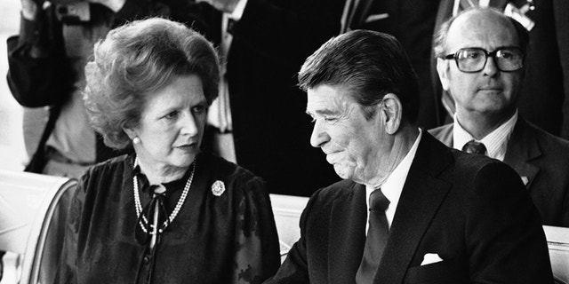 FILE - This is a Sunday, June 6, 1982 file photo of U.S. President Ronald Reagan and Britain's Prime Minister Margaret Thatcher at the lunch table, Sunday, June 6, 1982 at the Palace of Versailles, France, following the first session of the second days summit meeting. Margaret Thatcher felt betrayed by close ally Ronald Reagan over the Falkland Islands, according to newly released papers that reveal how isolated Britain's prime minister was in her determination to repel the Argentine invasion by force. When Argentina seized the British territory off the South American coast in April 1982, Thatcher's government presented a united front in public.(AP Photo/ File)