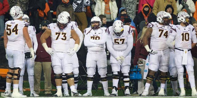 The Arizona State football team watch from the sidelines as time runs down during an NCAA college football game against Oregon State in Corvallis, Or., Saturday, Nov. 15, 2014. The Beavers beat the Sun Devils 35-27. (AP Photo/Troy Wayrynen)