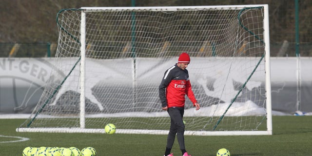 David Beckham is seen during a practice session with Paris Saint-Germain soccer team in Saint-Germain-en-Laye, west of Paris, Wednesday, Feb. 13, 2013. David Beckham started his first practice session with Paris Saint-Germain on Wednesday amid a media frenzy as dozens of camera crews and photographers jostled for position at the club's training ground in the western suburbs of Paris. (AP Photo/Michel Euler)