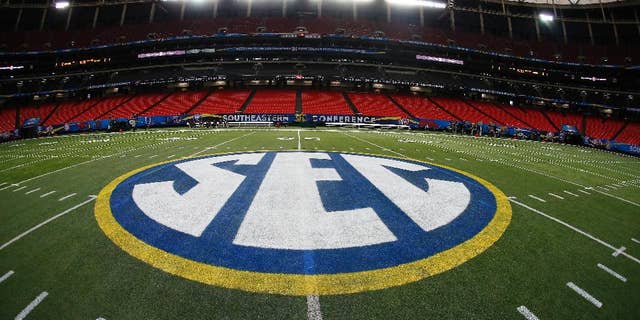 The SEC logo is seen Friday, Dec. 5, 2014, in Atlanta, ahead of the Southeastern Conference championship football game between Alabama and Missouri held Saturday. (AP Photo/John Bazemore)
