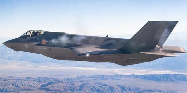 A pilot fires an F-35A's machine gun midflight during a test.