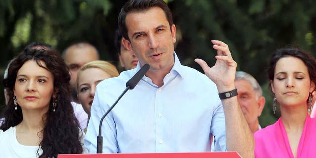 Erion Veliaj of the governing left wing Socialist Party-led coalition speaks to supporters after being elected as Tirana’s new mayor Tuesday, June 23, 2015. The post was kept from the main opposition Democratic Party leader Lulzim Basha, and is seen as key in boosting Albania's bid to launch membership negotiations with the European Union. (AP Photo/Hektor Pustina)
