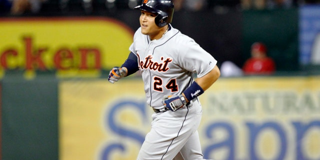Detroit Tigers Miguel Cabrera rounds the bases after hitting his second home run of the game against the Texas Rangers Sunday, May 19, 2013.
