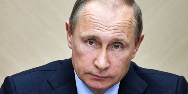 Russian President Vladimir Putin leads a cabinet meeting at the Novo-Ogaryovo residence outside Moscow, Russia, Wednesday, July 19, 2017. (Alexei Nikolsky, Sputnik, Kremlin Pool Photo via AP)