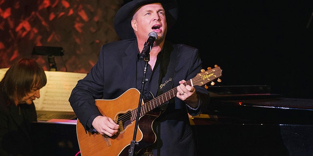 Nov. 17, 2014: Singer and songwriter Garth Brooks performs after accepting an award at the American Society of Composers, Authors and Publishers Centennial Awards in New York.