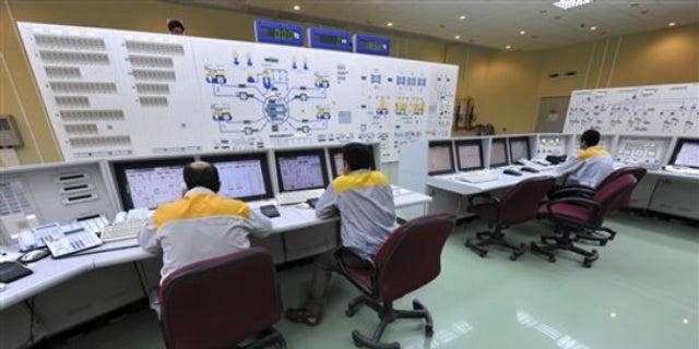 Iranian technicians work at the Bushehr nuclear power plant, outside the southern city of Bushehr, Iran.