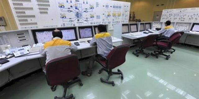 Iranian technicians work at the Bushehr nuclear power plant, outside the southern city of Bushehr, Iran.
