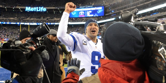File - In this Nov. 24, 2013 file photo, Dallas Cowboys quarterback Tony Romo (9) gestures while leaving the field after defeating the New York Giants 24-12 in an NFL football game, in East Rutherford, N.J. The winter blast that hit North Texas forced the Cowboys indoors when they were hoping to keep working outside in preparation for a bitterly cold Monday night in Chicago. The Cowboys don’t mind practicing in the elements because it worked pretty well leading up to a frigid win at the New York Giants two weeks ago. (AP Photo/Bill Kostroun, File)