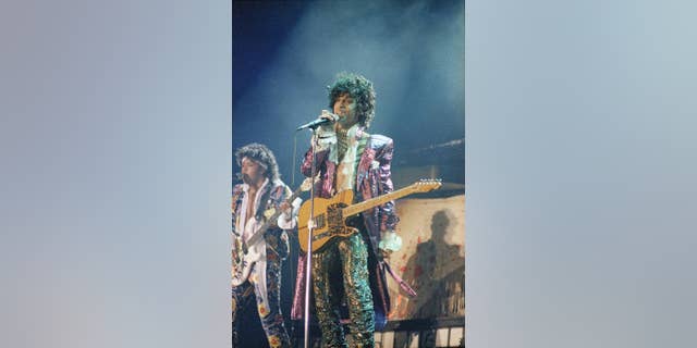 FILE - In this 1985 file photo, singer Prince performs in concert. Prince's old band is reuniting for some live shows following his death. Members of the Revolution made the announcement in a video posted online Tuesday, April 26, 2016. (AP Photo, File)