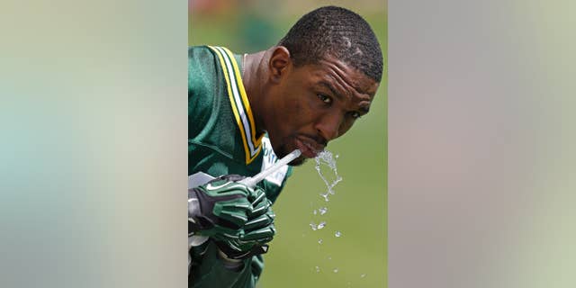 Green Bay Packers Demetri Goodson get a drink during NFL football minicamp Tuesday, June 17, 2014, in Green Bay, Wis. (AP Photo/Mike Roemer)
