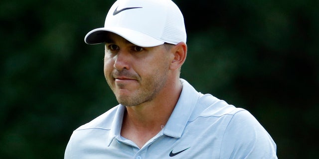 Brooks Koepka reacts after a birdie on the 17th green during the third round of the PGA Championship golf tournament at Bellerive Country Club, St. Luois, Aug. 11, 2018.