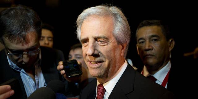 Uruguay's President Tabare Vazquez speaks to reporters as he arrives to the CEO Summit of the Americas in Panama City, Friday, April 10, 2015. The second CEO Summit organized by Panama's government and the Inter-American Development Bank, gathers business and political leaders, just before the start of the VII Summit of the Americas. (AP Photo/Moises Castillo)