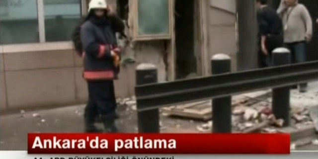 In this image made from video, emergency personnel are seen in front of a side entrance to the U.S. Embassy following a blast, Ankara, Turkey, Friday, Feb. 1, 2013. Turkish news reports say an explosion in front of the U.S. Embassy in the Turkish capital Ankara has injured several people. (AP Photo/NTV) TURKEY OUT