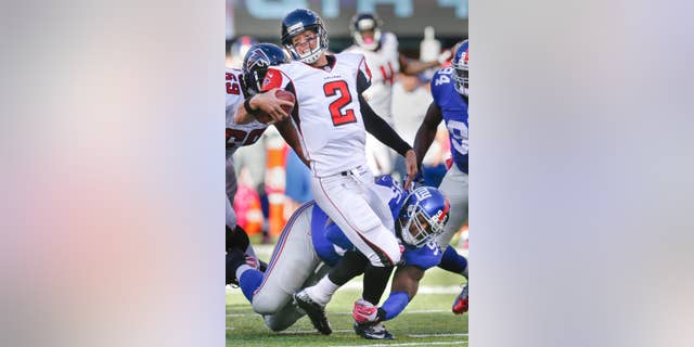 New York Giants defensive tackle Johnathan Hankins (95) sacks Atlanta Falcons quarterback Matt Ryan (2) during the second half of an NFL football game, Sunday, Oct. 5, 2014, in East Rutherford, N.J. (AP Photo/Kathy Willens)