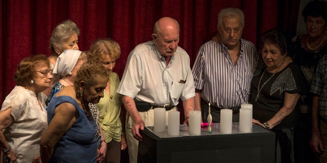 Holocaust survivors take part in a Holocaust Memorial Day ceremony in Buenos Aires, Jan. 27, 2015.