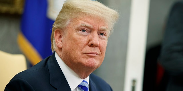 File - In this May 16, 2018 file photo, President Donald Trump listens to a question during a meeting in the Oval Office of the White House in Washington.