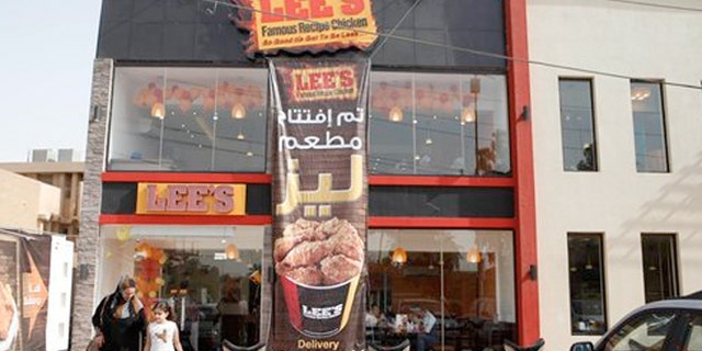Thursday, Aug. 23, 2012: Customers leave Lee's restaurant in Baghdad, Iraq.