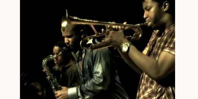 June 21, 2011: Musicians David Sánchez (middle) plays with his bandmates Christian Scott (R) and Stefon Harris (L).