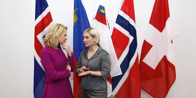 Liechtenstein's Minister of Foreign Affairs Aurelia Frick, left, speaks with Iceland's Minister for Foreign Affairs and External Trade Lilja Alfredsdottir, right, prior an EFTA Ministerial meeting at the headquarters of the European Free Trade Association, EFTA, in Geneva, Switzerland, Monday, Nov. 21, 2016. (Salvatore Di Nolfi/Keystone via AP)