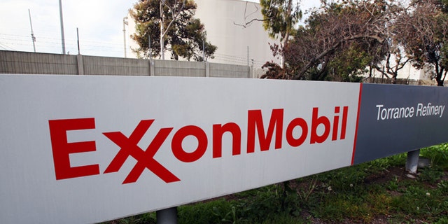 FILE - This Jan. 30, 2012, file photo, shows the sign for the ExxonMobil Torerance Refinery in Torrance, Calif. Exxon Mobile on Monday, Feb. 2, 2015, reported fourth-quarter earnings of $6.57 billion. (AP Photo/Reed Saxon, File)
