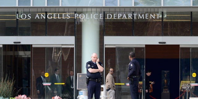 LAPD officers are deployed around the police headquarters on February 7, 2013 in Los Angeles.