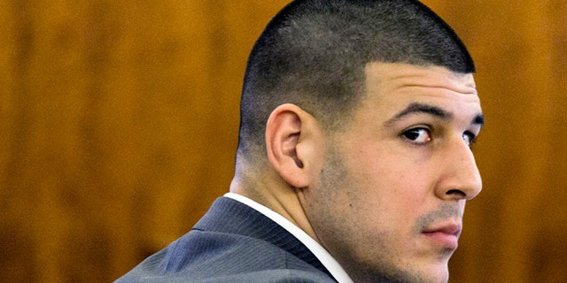 Former New England Patriots football player Aaron Hernandez looks at the prosecutor during his murder trial at Bristol County Superior Court Tuesday, March 3, 2015, in Fall River, Mass. Hernandez is accused of the June 2013 killing of Odin Lloyd. (AP Photo/Dominick Reuter)
