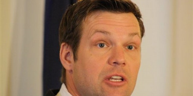 Kansas Secretary of State Kris Kobach speaks during a news conference about his legislation for fighting election fraud, Tuesday, Jan. 18, 2011, in Topeka, Kan. (AP Photo/John Milburn)