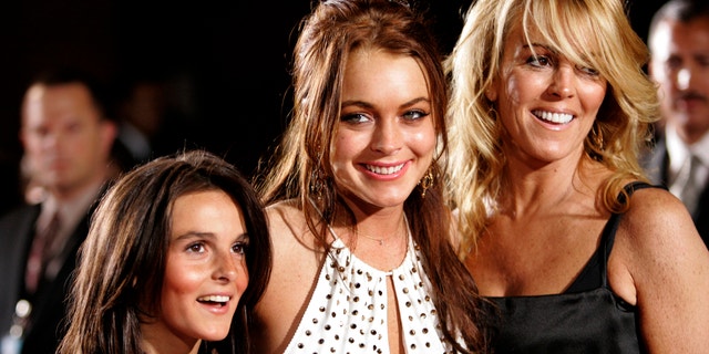 Lindsay Lohan poses with her mother Dina and sister Aliana at premiere of "Just My Luck" in Los Angeles.