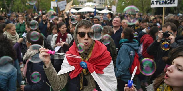 People gather in Budapest, Hungary, Saturday, April 15, 2017, to oppose government policies that are seen as limiting academic freedom and intimidating civic groups that receive foreign funding. (Zoltan Balogh/MTI via AP)