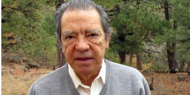 FILE - This Oct. 22, 2009, file photo shows former Los Alamos National Laboratory nuclear physicist Pedro Leonardo Mascheroni on his back deck in Los Alamos, N.M. Mascheroni pleaded guilty to trying to help Venezuela develop a nuclear weapon was sentenced Wednesday, Jan. 28, 2015, to five years in prison and three years of supervised release. Mascheroni and his wife, Marjorie Roxby Mascheroni, had pleaded guilty in 2013 to offering to help develop a nuclear weapon for Venezuela through dealings with an undercover FBI agent posing as a representative of the socialist South American country. (AP Photo/Heather Clark, File)