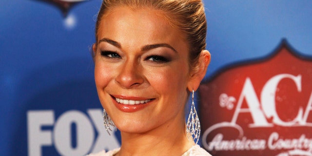 Singer Leann Rimes poses backstage during the 4th annual American Country Awards in Las Vegas, Nevada December 10, 2013. REUTERS/Steve Marcus (UNITED STATES - Tags: ENTERTAINMENT HEADSHOT) - RTX16DAE