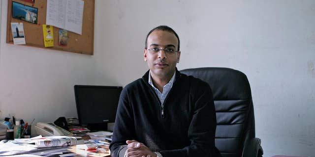 FILE -- This Dec. 7, 2011 photo, shows Hossam Bahgat in his office at the Egyptian Initiative for Personal Rights in Garden City, Cairo, Egypt. An Egyptian court on Saturday, Sept. 17, 2016 upheld a decision to freeze the assets of several prominent human rights campaigners in the latest blow to a once-vibrant activist community that has been largely silenced by a government crackdown. The five activists named in the court ruling include Gamal Eid and Bahey eldin Hassan, who head two well-known human rights organizations, as well as investigative reporter Hossam Bahgat, also the founder of a rights group. The other two are Mustafa el-Hassan and Abdel-Hafiz Tayel. (Sarah Rafea via AP, File) MANDATORY CREDIT