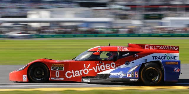 In this Saturday, Jan. 24, 2015 file photo, Andy Meyrick, of England, drives the DeltaWing DWC13 Elan out of turn during the IMSA 24 hour auto race at Daytona International Speedway in Daytona Beach, Fla. Among the story lines in IMSA this year is the strength of the odd-looking DeltaWing, which led laps in the season-opening Rolex 24 at Daytona. (AP Photo/John Raoux, File)