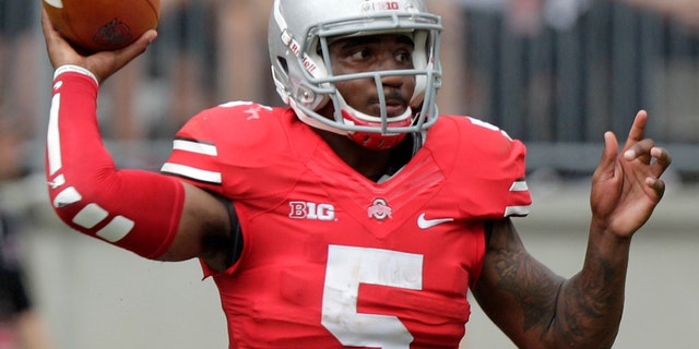 FILE - In this Aug. 31, 2013, file photo, Ohio State quarterback Braxton Miller throws a pass against Buffalo during an NCAA college football game in Columbus, Ohio. Miller is expected to start for the Buckeyes at No. 16 Northwestern this Saturday. (AP Photo/Jay LaPrete, File)