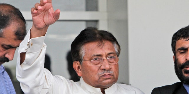 In this Sunday, March 24, 2013 photo, Former Pakistani President Pervez Musharraf, gestures upon his arrival to Karachi airport, Pakistan. Musharraf was given approval on Sunday, April 7, 2013 to run for parliament in a remote northern district after being rejected in two other parts of the country, his aide said. (AP Photo/Shakil Adil)