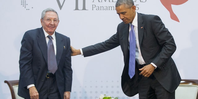 US President Barack Obama with Cuban President Raul Castro during their meeting at the Summit of the Americas in Panama City, Panama, Saturday, April 11, 2015. The leaders of the United States and Cuba held their first formal meeting in more than half a century on Saturday, clearing the way for a normalization of relations that had seemed unthinkable to both Cubans and Americans for generations. (AP Photo/Pablo Martinez Monsivais)